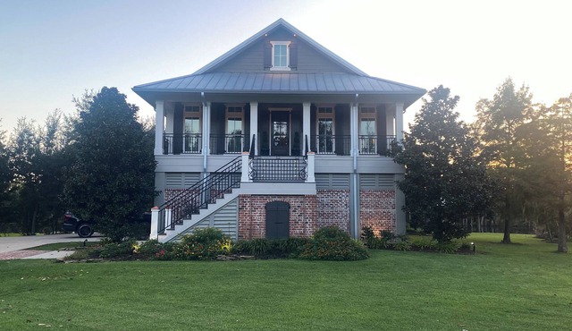 River front paradise with large dock and outdoor space, great for entertaining.