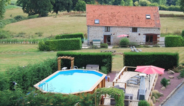 Rustic & spacious converted stone barn with heated pool & sun terrace in Isigny le buat