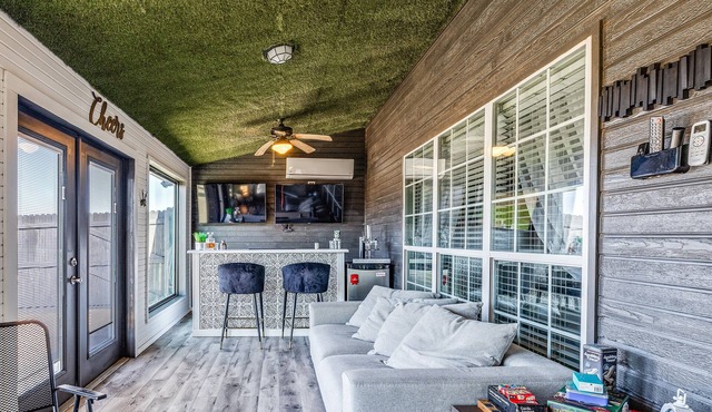 Stylish corner home with cozy interiors, a private bar, and inviting charm